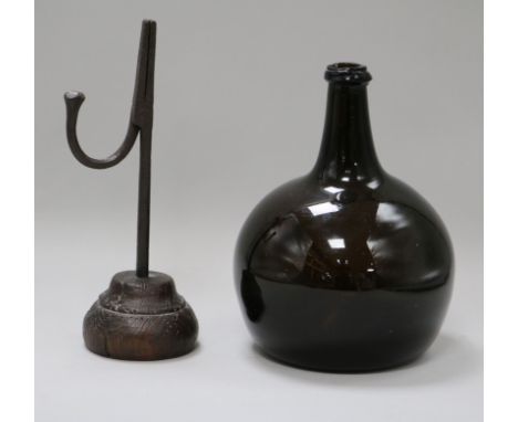 An 18th century rush light and early Dutch bottle rush light 24cm