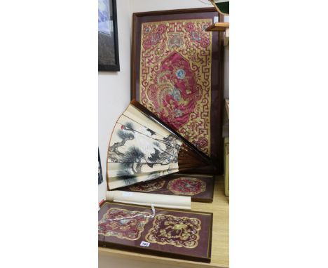 Three framed Chinese embroidered panels, a fan and a scroll