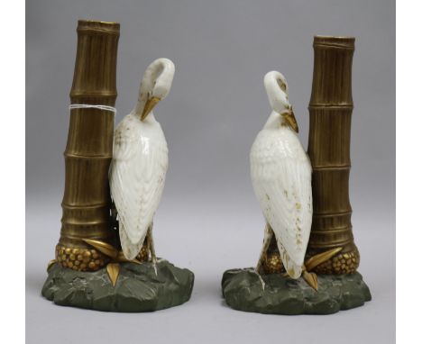 A pair of Royal Worcester heron and bamboo spill vases, pattern number, 852