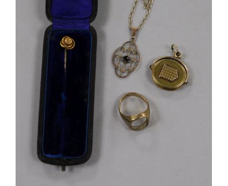 An Edwardian openwork pendant on fine chain and three other items, including a 9ct gold signet ring (lacking matrix), a 15ct 