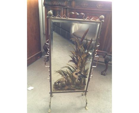 A mirrored fireguard with heron paint work