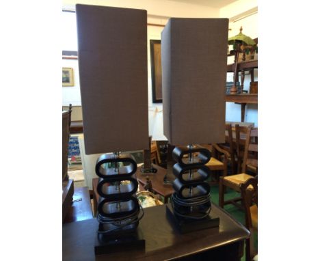 Pair of black stacked oval lamp base with square conical shades