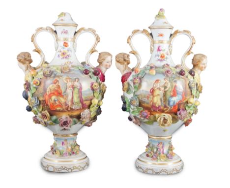 A pair of Potschappel porcelain vases and cover, late 19th century, each flower and fruit encrusted and painted with classica