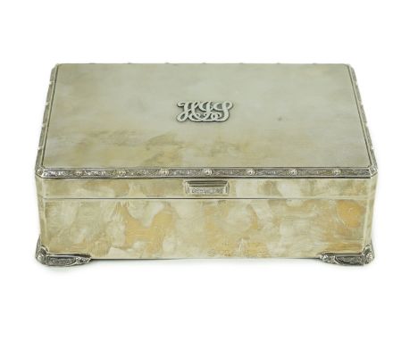 A large 1930's silver mounted rectangular cigar box, by Adie Brothers, with Celtic knot decoration, on conforming feet, Birmi