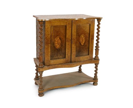 A 19th century Irish yew wood, oyster veneered and burr wood serpentine collector's cabinet, with a pair of shell inlaid pane