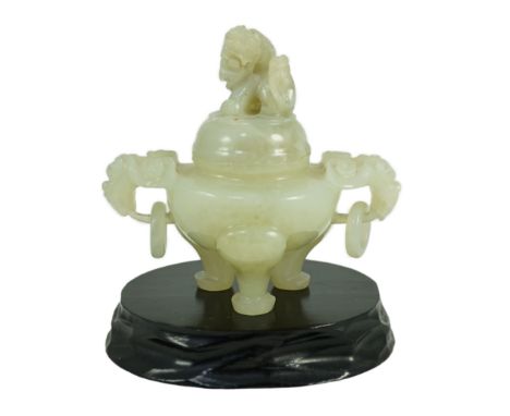 A Chinese pale celadon jade tripod censer cover, 20th century, 12cm wide, wood standOccasional natural inclusions and veining