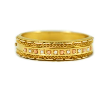 A late Victorian 15ct gold coral bead and seed pearl set part cannetile work hinged bangle, inner diameter 56mm, gross weight