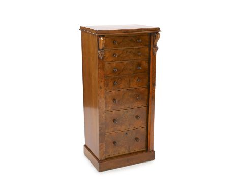 A Victorian figured walnut secretaire Wellington chest, with scroll carved brackets, five drawers and fall front secretaire d