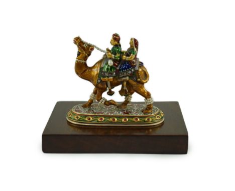 A 20th century Indian Mughal style gold, polychrome enamel, diamond, seed pearl and cabochon ruby set miniature model of a ca