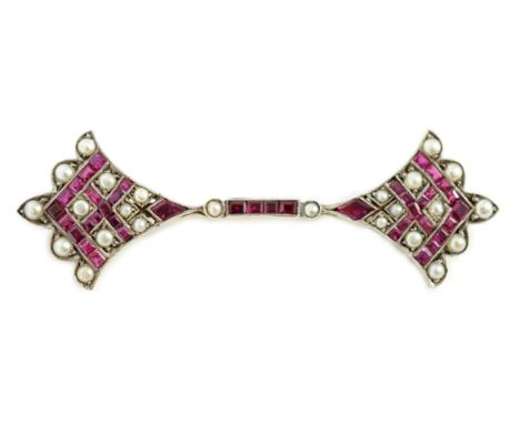 An early 20th century, gold, platinum, ruby and seed pearl set brooch, with fan shaped terminals, 57mm, gross weight 7.2 gram