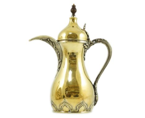 A late 1970's parcel gilt silver coffee pot, modelled as a dallah, by Asprey &amp; Co Ltd, London, 1979, height 30cm, 38oz.Ob