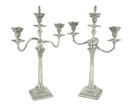 A pair of late Victorian silver two branch, three light Corinthian column candelabra, by Aldwinckle &amp; Slater, with acanth