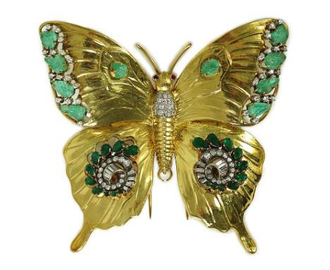 A modern 18ct gold, emerald and diamond set butterfly clip brooch, with ruby set eyes, oval and carved oval cut emeralds, gra