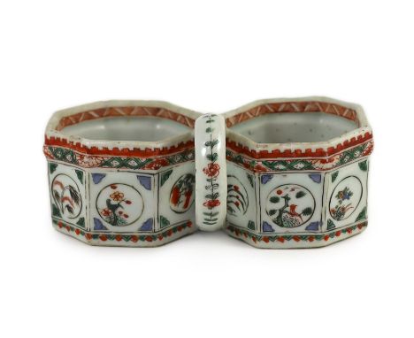 An unusual Chinese famille verte double bottle holder, Kangxi period, painted to the twin octagonal compartments with flower,
