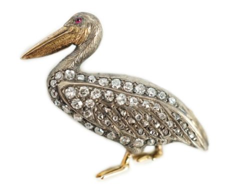 A Victorian style diamond encrusted and ruby set brooch, modelled as a pelican, with textured feathers, 25mm, gross weight 4.