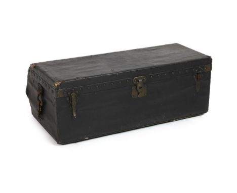 A Louis Vuitton motoring trunk, with studded black leather covering, and brass loop handles with remnants of leather straps, 
