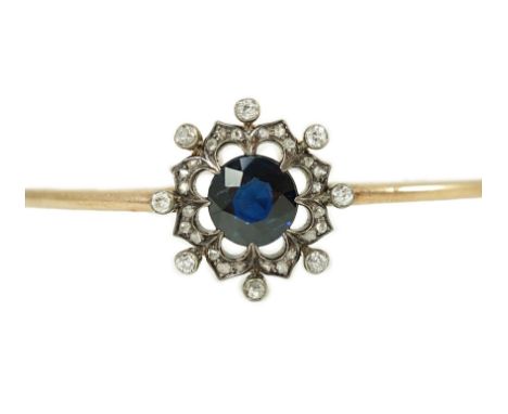 A Victorian gold, sapphire and diamond cluster set hinged bangle, interior diameter approx. 57mm, cluster 19mm, gross weight 