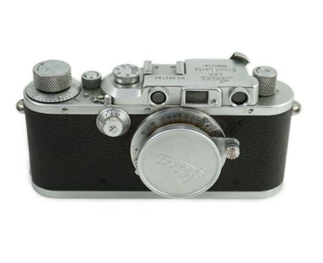 A Leica IIIa camera, number 302196 with Leitz Elmar F51:35 lens, Elmar 5cm adapter ring and leather casesLooks to be in good 