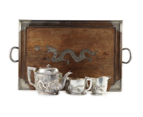 An early 20th century Chinese Export three piece silver tea set and matching silver inlaid hardwood two handled tea tray, by 