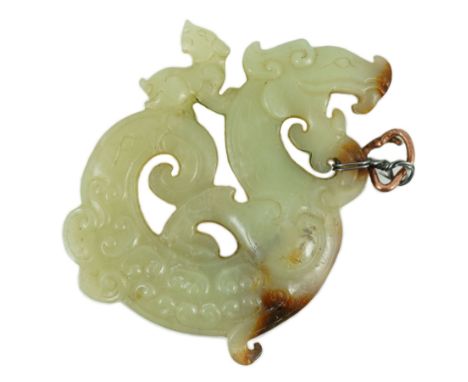 A Chinese archaistic yellow and russet jade openwork plaque, possibly Song-Yuan dynasty, in the form of a dragon and young, c