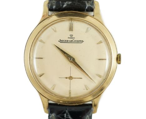 A gentleman's 9ct gold Jaeger LeCoultre manual wind dress wrist watch, on associated strap, with baton numerals and subsidiar