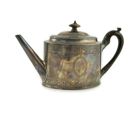 A George III silver oval teapot, by Hester Bateman, with engraved decoration and applied monogrammed oval patch (to cover a s