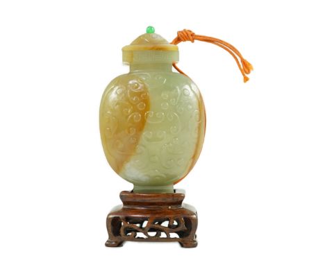 A Chinese archaistic green and russet jade miniature vase and cover, fanghu, 19th century, carved in relief with C-scrolls, t