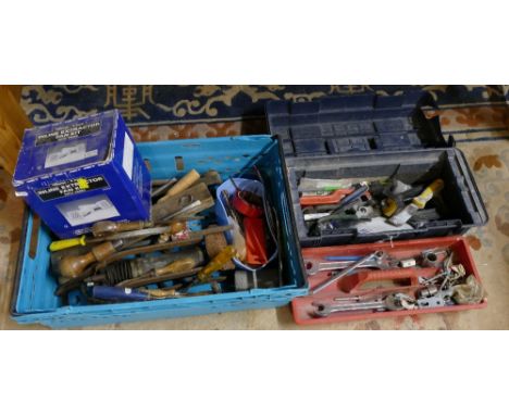 Tool box and a crate containing hand tools.