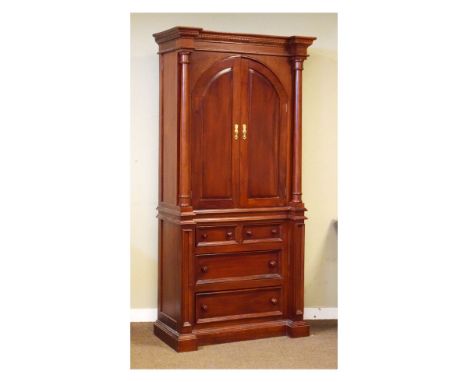 Reproduction mahogany cabinet on chest of inverted breakfront design, the upper section having a pair of arch-panelled doors 