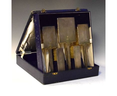 Edward VIII silver backed brush and mirror set comprising: two pairs of brushes and hand mirror, all with engine turned backs