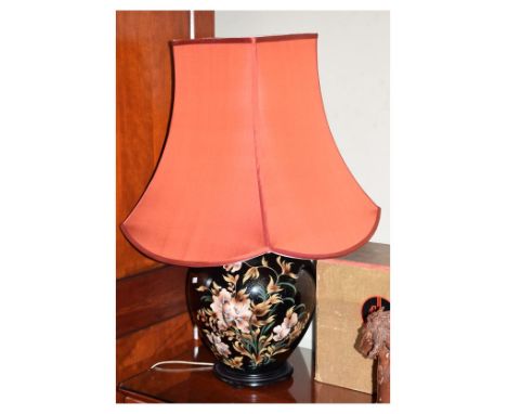 Oriental-style table lamp with ovoid body having floral decoration, beneath large fabric shade, 83cm high overall   Condition