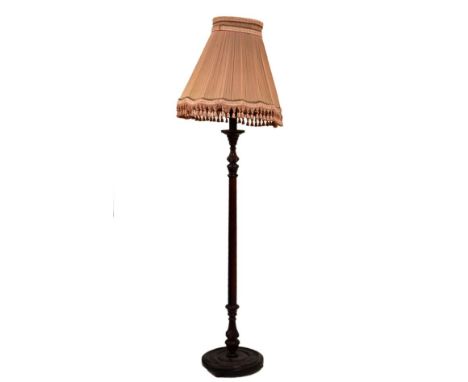 Modern carved mahogany-stained standard lamp with fluted stem on circular base, complete with shade   Condition: 