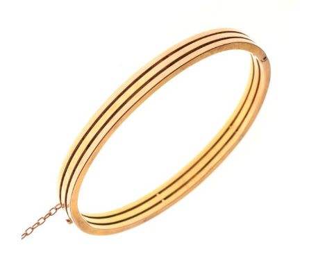 Gold coloured metal snap bangle of triple conjoined hoop design, 12.4g gross approx   Condition: 