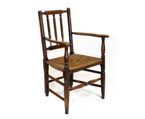 19th Century rush-seated turned ash armchair with bobbin-turned top rail and vertical bars above open arms on turned supports