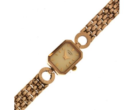 Rotary - Lady's 9ct gold wristwatch, canted oblong dial with baton hour markers, to a flexible strap, 17g gross approx   Cond