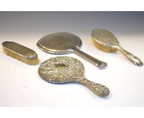 Three piece dressing table set comprising: hand mirror, and two brushes, all with engraved monogram, stamped 'Sterling', toge