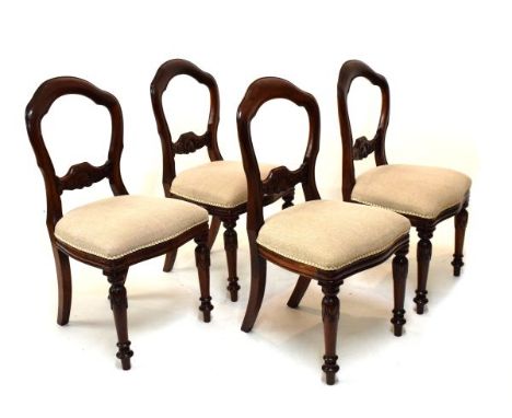 Set of four Victorian style mahogany buckle-back dining chairs, each having a fixed serpentine seat on turned front supports 