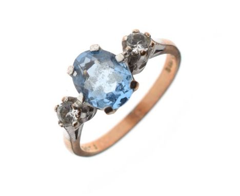 9ct gold dress ring set central pale blue stone flanked by two white stones, size O½, 3.1g gross approx   Condition: 