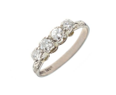 Four stone diamond ring, the white metal shank stamped 18ct, size L, 2.3g  gross approx   Condition: 