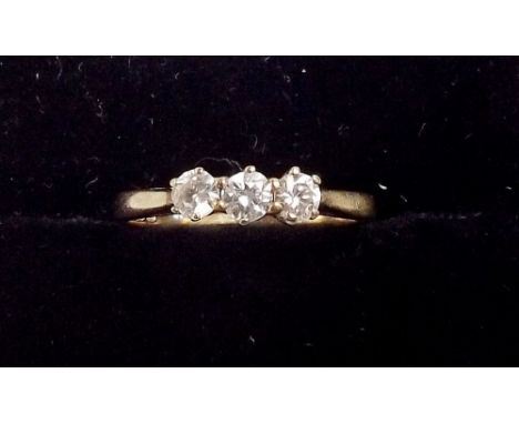 A 9ct gold three stone diamond ring , K.5