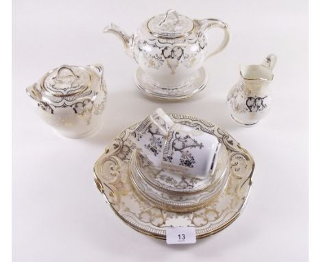 A Victorian cream and gilt tea service comprising: eleven cups, twelve saucers, twelve tea plates, two cake plates, teapot an