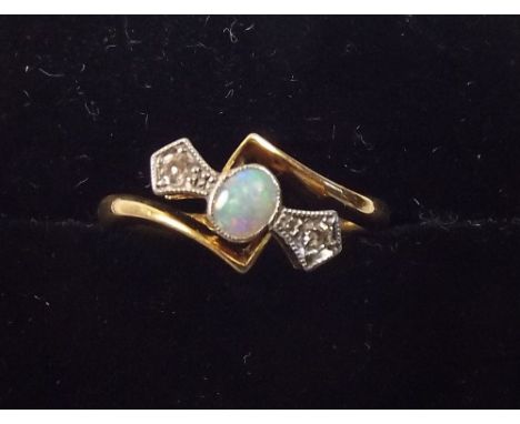 An 18ct gold opal and diamond ring, size J.5 