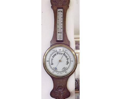 An early 20th century oak cased barometer/thermometer 
