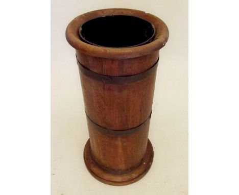 A brass bound oak stick stand 