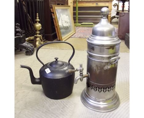 An old samovar and a black painted kettle 
