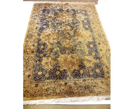 A blue and gold patterned Bangladesh carpet 262 x 183cm