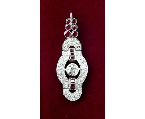 A fine Art Deco style ruby and diamond set pendant - the central stone approx half a carat 
