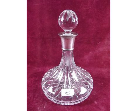 A silver mounted cut glass decanter