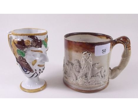 A Victorian Prattware Bacchus form frog mug with hairline crack and a stoneware frog mug 