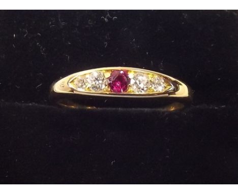 An 18ct gold five stone ruby and diamond ring , size Q